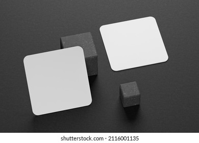 3d Mockup Of A Square Business Card With Rounded Corners On A Black Paper Background