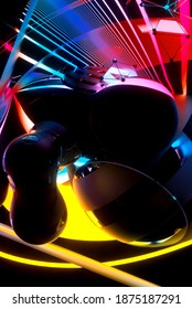 3d render of abstract art with part of surreal flying meta balls cubes and rings or festive party balloons with parallel lines pattern on surface with neon glowing purple yellow and blue color lights 