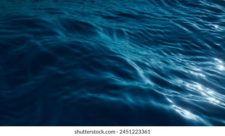 3d render, abstract background of a tranquil and deep blue water surface, with gentle ripples catching the light, conveying a sense of calm and depth. Wallpaper of wavy sea surface