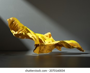 3d Render. Abstract Fashion Background With Yellow Fabric Cloth Falling On The Floor Inside The Dark Room Illuminated With Ray Of Light. Silk Textile Is Blown Away By The Wind