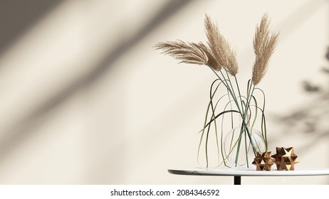 3D Render Background. Ornamental Dry Grass Flowers In A Glass Vase With Brass Decor Polygon Balls On A White Round Table With With Morning Sunlight And Beautiful Leaves Shadow On The Blank Beige Wall.