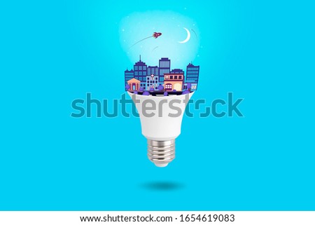 3d render.Big city creates bright ideas with LED Bulb. night style concept. Light sky background.