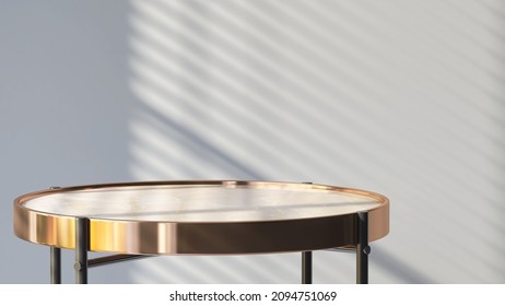 3D render of an empty round marble side table with metallic gold rim for products display. Blind curtain shadow and sunlight on gray wall in background. Overlay, Backdrop, Shinny, Brass, Luxury.