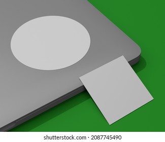 3d Render Mockup Of A Round Sticker On A Laptop Plus A Square Business Card On A Green Chromakey Background For Easy Background Color Change