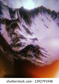 3d rendering of abstract mountains with lo-fi old film photography effect. A blurry, moody landscape. Night scene with flickering snow at sierra tops. Nostalgic vintage feeling.  Burnt film filter