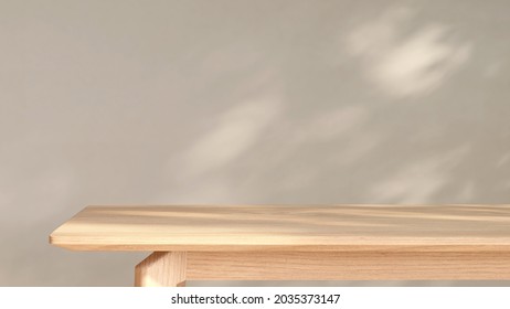3D rendering of a beautiful wooden table for products display in front of an empty wall with beautiful sunlight and leaves shadow. Background, Mock up, Backdrop, Home, Natural, Organic, Space, Overlay