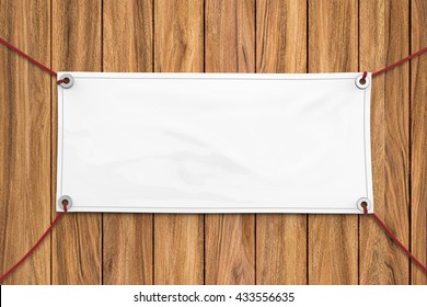 3d Rendering Blank Vinyl Banner Hanging On Wooden Background