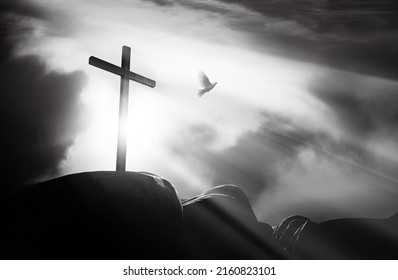 3D rendering - A bright light shines through the dark sky background and Golgotha hill clouds and white doves, the holy cross symbolizes the suffering, death and resurrection of Jesus Christ.