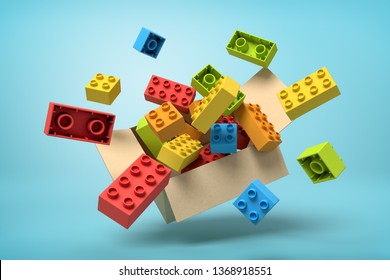 3d Rendering Of Cardboard Box In Air Full Of Colorful Toy Bricks Which Are Flying Out And Floating Outside On Blue Background. Children's Goods. Toys And Games. Toy Manufacture.