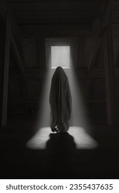 3D rendering of a ghost covered with sheet floating in the air and illuminated by a light ray in the attic