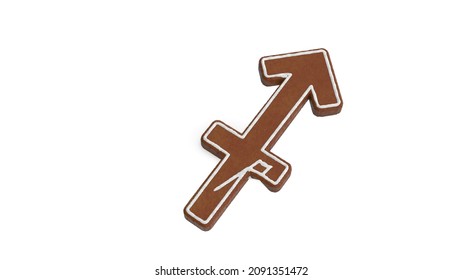 3d rendering of gingerbread cookie in shape of symbol of Sagittarius zodiac horoscope isolated on white background with white icing