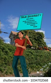 3d rendering of a 3d illustration containing a young man protester carrying a sign for diversity