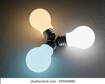 3D rendering image of 3 light bulb or lamps place on the cracked concrete floor. Night scenc perspective. Color temperature scale. Cool white,warm white, day light. different 3 colors of light effect