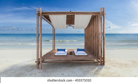 3D rendering image of bamboo tent which cover by fabric located on the beach,  fabric ceiling being blow by wind from the sea, white and blue day bed and pillow