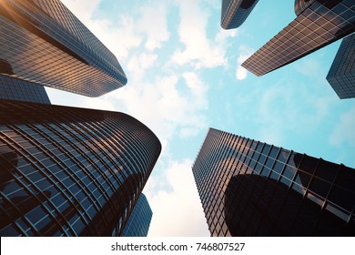 3d rendering Low angle view of skyscrapers. Skyscrapers at sunset looking up perspective. Bottom view of modern skyscrapers in business district in evening light at sunset. Business concept of success