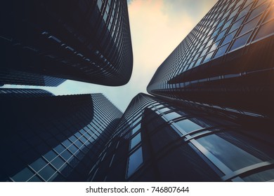 3d rendering Low angle view of skyscrapers. Skyscrapers at sunset looking up perspective. Bottom view of modern skyscrapers in business district in evening light at sunset. Business concept of success