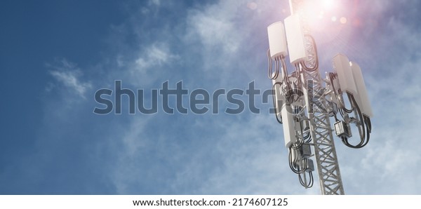 3D Rendering of mobile phone signal repeater\
station tower with blue sky background. For telecommunication\
industry, 4g 5g mobile\
data.