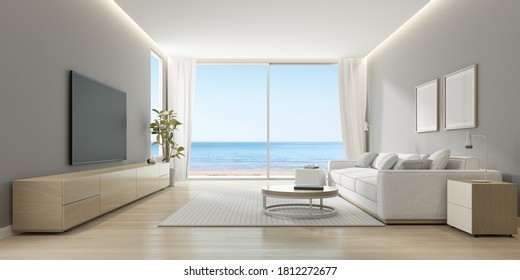 3D rendering of modern living room with TV screen and sofa on sea background.