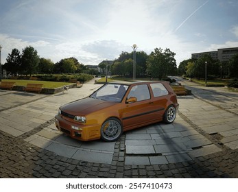 3d rendering - Modified compact car in urban park setting under a sunny sky.