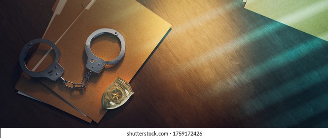 3D Rendering Of A Police Badge With Handcuffs On A Dark Background