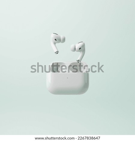 3d rendering. realistic white pair of wireless earphones on light pastel green backgroung with copy space. Minimal elegant illustration. Music technology concept