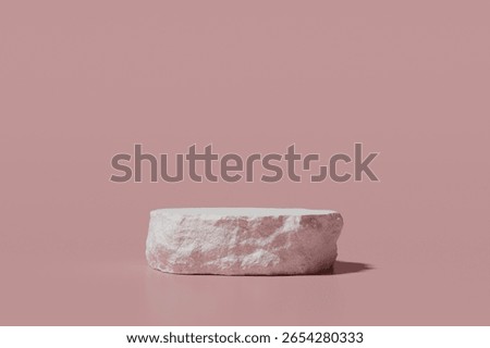 3D Rendering. Rough Textured Pink Stone Podium on Solid Pastel Background for Product Display