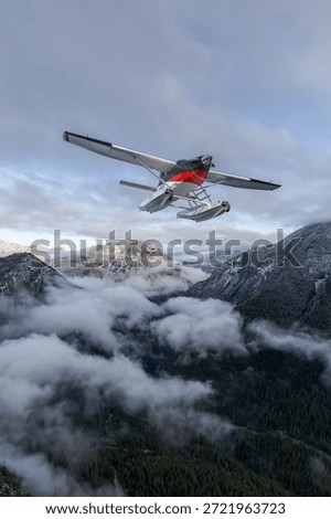 A 3D rendering of a seaplane in flight above snow-capped mountains and clouds. 3d Rendering Airplane. Background from BC, Canada.