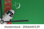 3D Rendering of a top down view of a White Helicopter in the Bottom Left Corner and on top of the National Flag of Turkmenistan