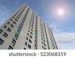 3D rendering of a tower building with colored glass