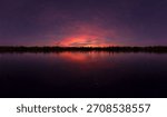 3d Rendering of a tranquil sunset over a calm lake, starry sky, and silhouetted trees reflecting on the water.