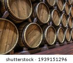 3d rendering of vine cellar with oak barrels stacked in rows