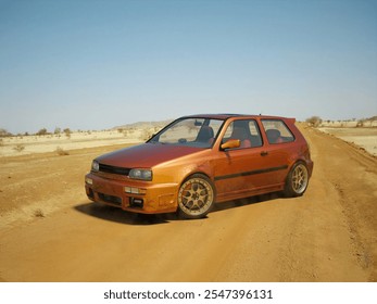 3d rendering - A vintage orange hatchback car travels along a dusty, rural dirt road under a clear blue sky.