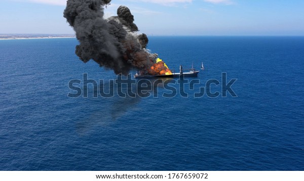 3D\
rendering-Cargo ship burning on fire with large scale\
smoke-Aerial\
Aerial, Mediterranean Sea, Cargo tanker ship, Real\
Drone view with visual effect Elements\
\
