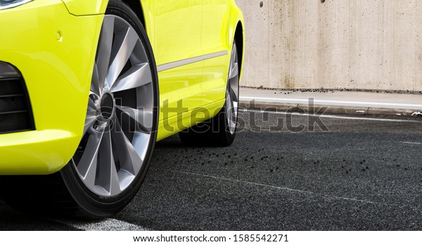 3d yellow sports car stands\
in the city on the road, concept 3d render for advertising auto\
products