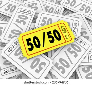 50-Fifty word and numbers on a golden raffle ticket in a pile to illustrate drawing for a fundraising or charity contest winner - Powered by Shutterstock