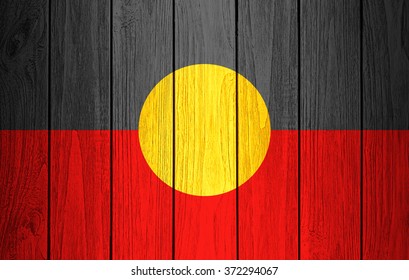 Aboriginal Australia Flag Painted On Old Wood Plank Background 