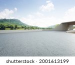 Abstract architecture design of modern building. Empty parking area floor and concrete wall with mountain and blue sky lake view. 3D rendering background image for car scene.