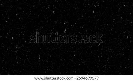 Abstract black background with falling rain and snow particles creating cinematic texture and soft motion blur effect for overlay, weather, or atmospheric visual design