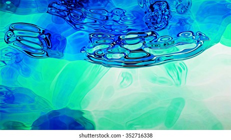 Abstract blue fluid forms on a white background.