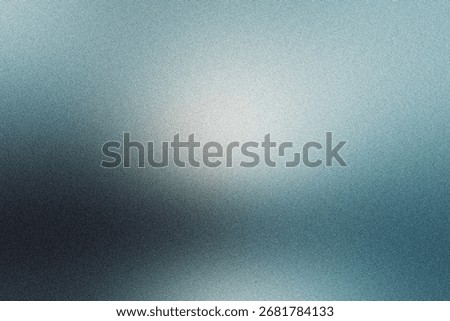 Abstract blue gradient background showing light fading to dark, featuring frosted glass texture with grainy effect