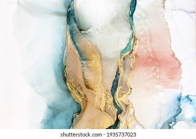 Abstract blue-green background with gold and beautiful smudges made with alcohol ink and golden acrylic. Fragment of art with turquoise texture resembles watercolor or aquarelle painting.

