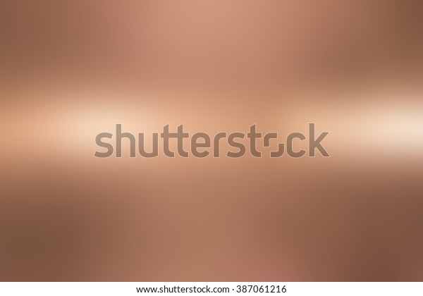 abstract blur bronze metallic plain surface\
background concept for design and\
decorate.