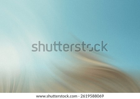 Abstract blurred background featuring a blend of blue beige and white tones creating a soft effect