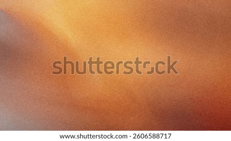Abstract blurred background featuring warm tones of orange yellow and brown creating a soft gradient effect