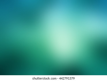 abstract blurry blue green sky background with bright light leak bokeh or sunspot flare, abstract smooth textured bright white shiny center spot on blurred teal background