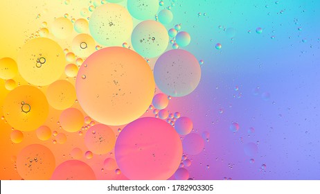 Abstract colorful macro background of oil droplets on water