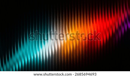 An abstract composition featuring a diagonal band of vibrant, multicolored light streaks against a dark, black background, showcasing a spectrum of colors.