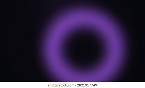 Abstract dark background featuring bright glowing purple ring light flare effect with scattered dust particles for artistic digital display or wallpaper.