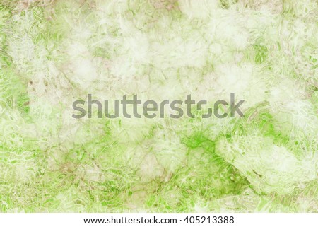 abstract glassy background pattern in soft pastel colors of green and white with brown stain grunge, glass textured ripples or wrinkles in pretty graphic art design for websites or projects