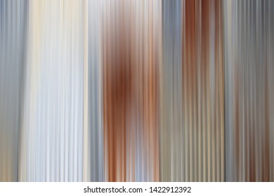 Abstract gradient gray or light background texture with vertical motion blur.